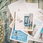 An artistic collection of travel-themed photos with a pineapple on rustic wood.